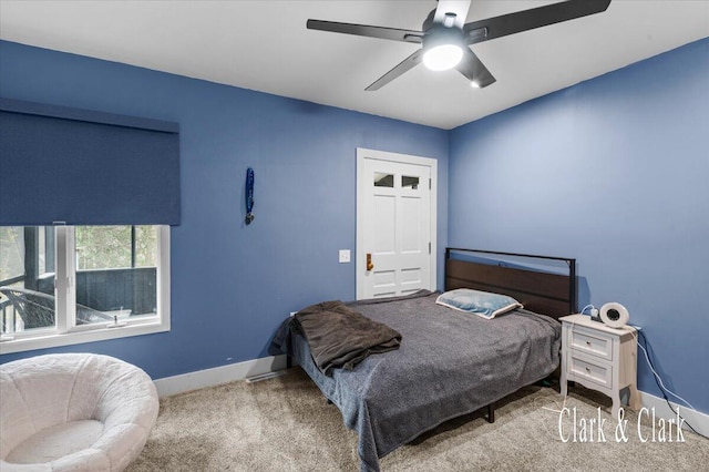 bedroom featuring carpet, a ceiling fan, and baseboards