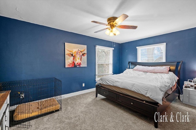 bedroom with ceiling fan, carpet floors, and baseboards
