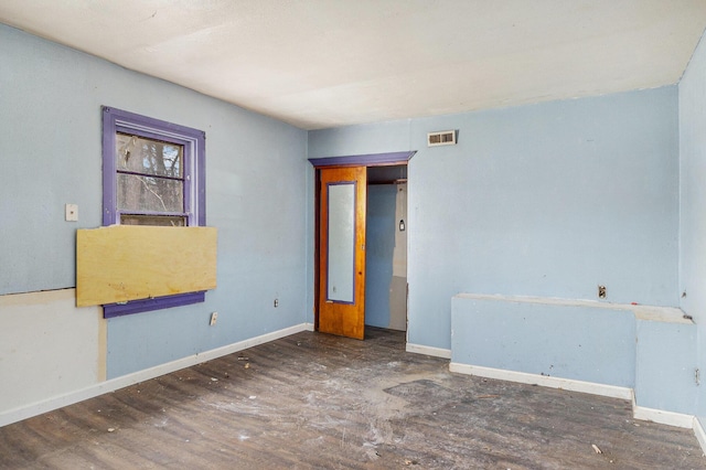 3309 Greenfield Ave, Kalamazoo, MI 49048 - spare room with visible vents, baseboards, and wood finished floors