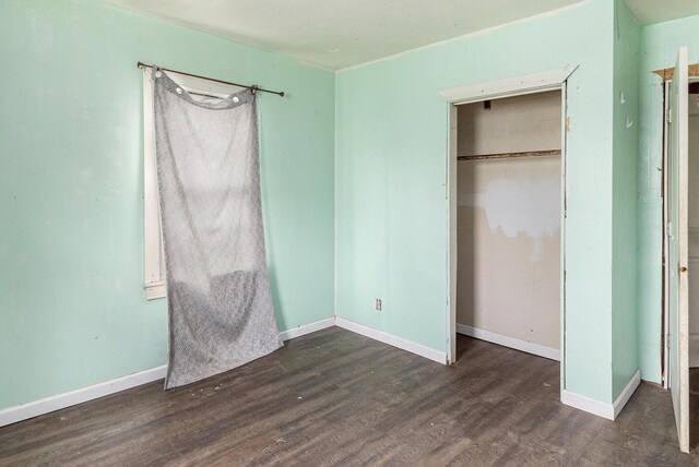 3309 Greenfield Ave, Kalamazoo, MI 49048 - unfurnished bedroom with wood finished floors, baseboards, and a closet