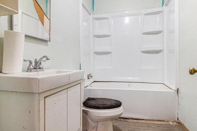 3309 Greenfield Ave, Kalamazoo, MI 49048 - bathroom featuring toilet, shower / tub combination, vanity, and wood finished floors