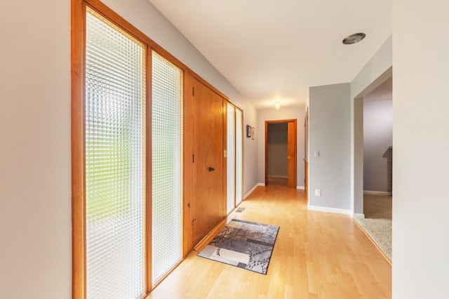 3010 Hill An Brook Dr, Portage, MI 49024 - corridor featuring light wood-style floors and baseboards