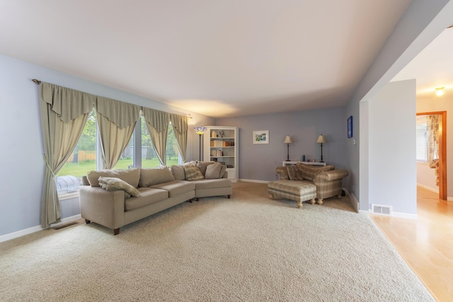 3010 Hill An Brook Dr, Portage, MI 49024 - living room featuring plenty of natural light, baseboards, and light colored carpet