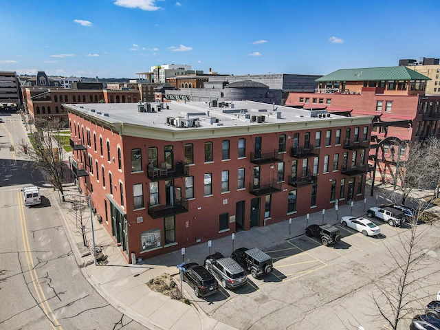 view of building exterior featuring uncovered parking