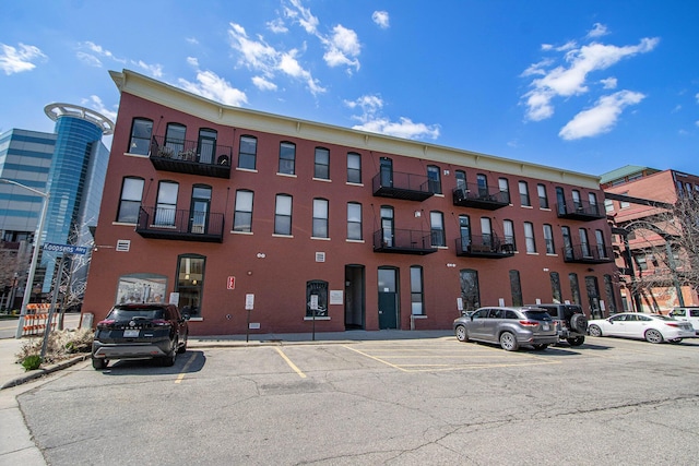 view of property with uncovered parking