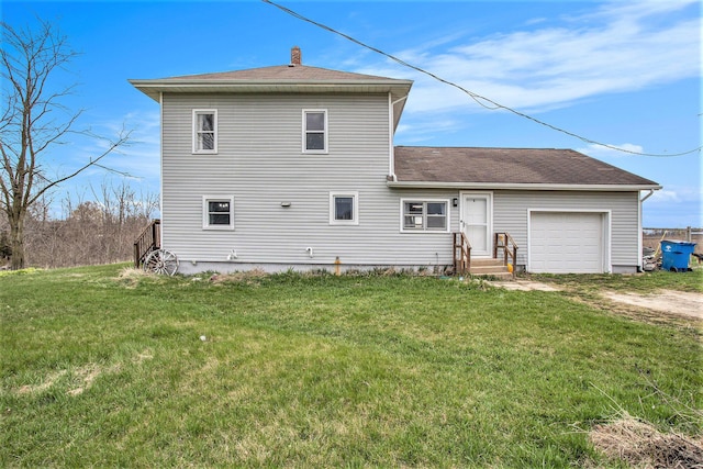 13627 Cadmus Rd, Hudson, MI 49247 - back of house with a chimney, entry steps, an attached garage, a yard, and dirt driveway