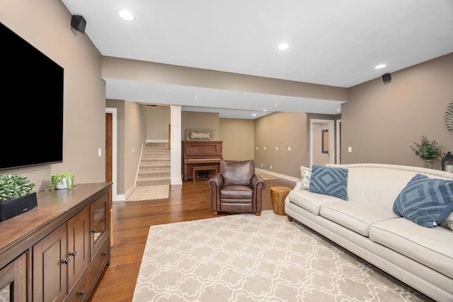 8702 E 98th St, Howard City, MI 49329 - living area with wood finished floors, stairs, and recessed lighting