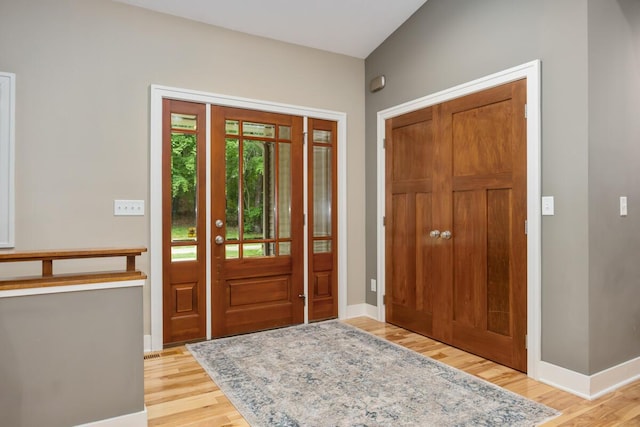 8702 E 98th St, Howard City, MI 49329 - entrance foyer with light wood-style flooring and baseboards