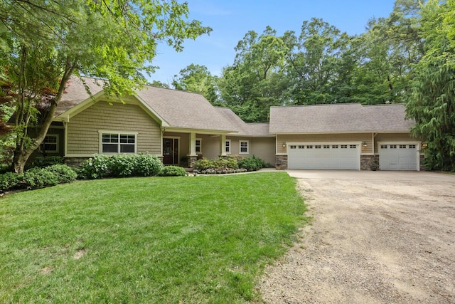 8702 E 98th St, Howard City, MI 49329 - view of front of home with stone siding, driveway, a garage, a front lawn, and a shingled roof