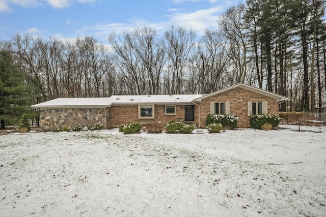 view of front of home featuring brick siding