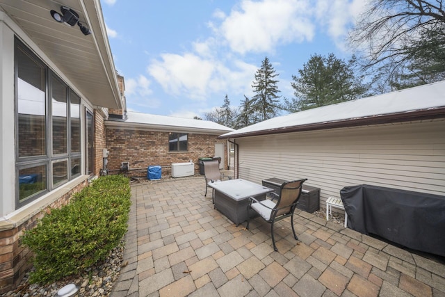 view of patio with a grill and outdoor dining space