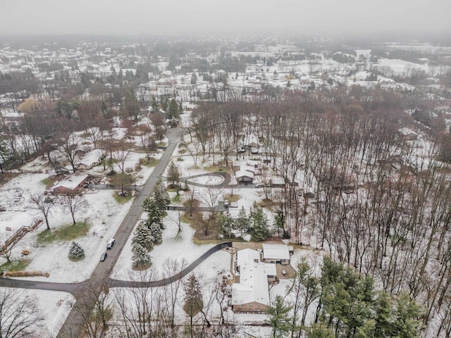 snowy aerial view featuring a residential view