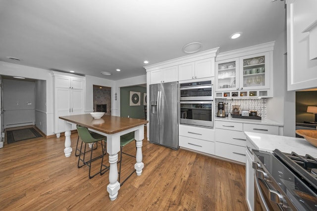 kitchen featuring white cabinets, recessed lighting, and appliances with stainless steel finishes