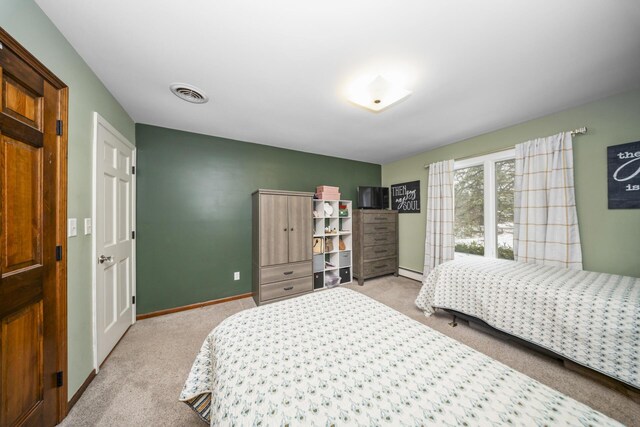 bedroom with baseboards, carpet flooring, and visible vents