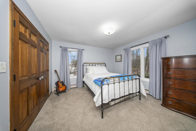 bedroom with light carpet