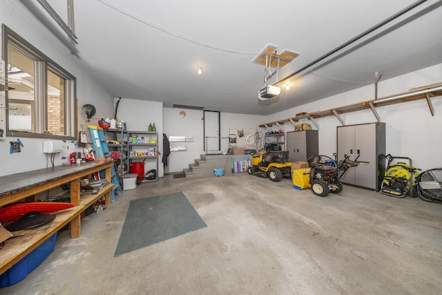 garage featuring a workshop area and a garage door opener