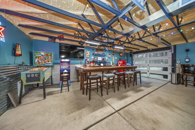 dining room with concrete floors, visible vents, and a workshop area