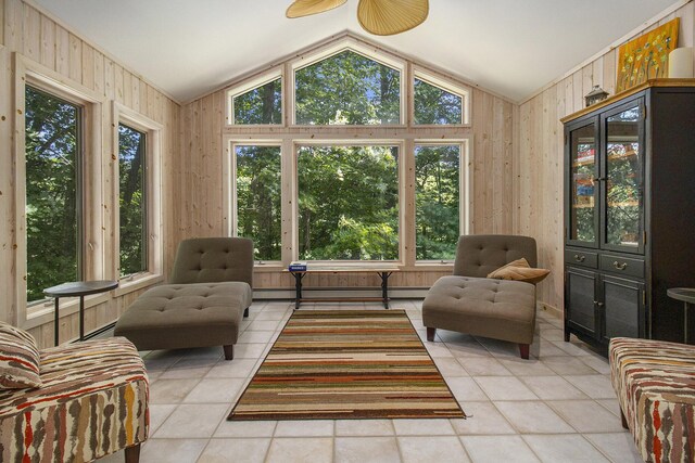 5410 Oak Ridge Rd, Ludington, MI 49431 - sunroom with wooden walls, tile patterned floors, a baseboard heating unit, and vaulted ceiling