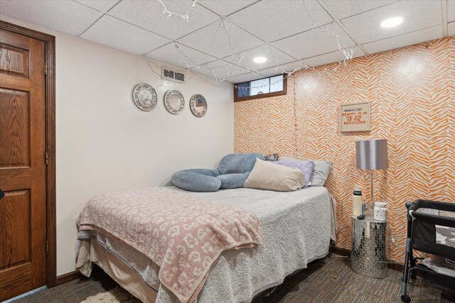 846 Morton Rd, Horton, MI 49246 - bedroom with recessed lighting, visible vents, a drop ceiling, and wallpapered walls