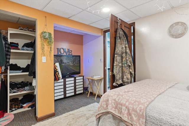 846 Morton Rd, Horton, MI 49246 - carpeted bedroom featuring a closet and a drop ceiling