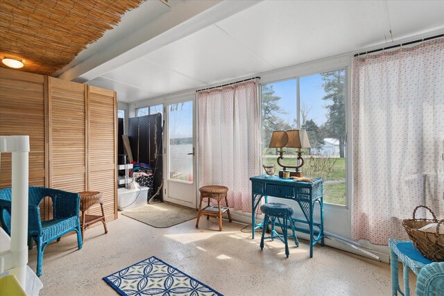 846 Morton Rd, Horton, MI 49246 - sunroom with a healthy amount of sunlight, speckled floor, and beam ceiling