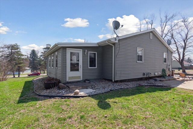 846 Morton Rd, Horton, MI 49246 - back of house with a yard and a patio area