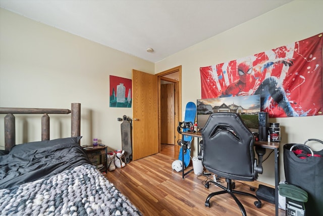 bedroom with wood finished floors