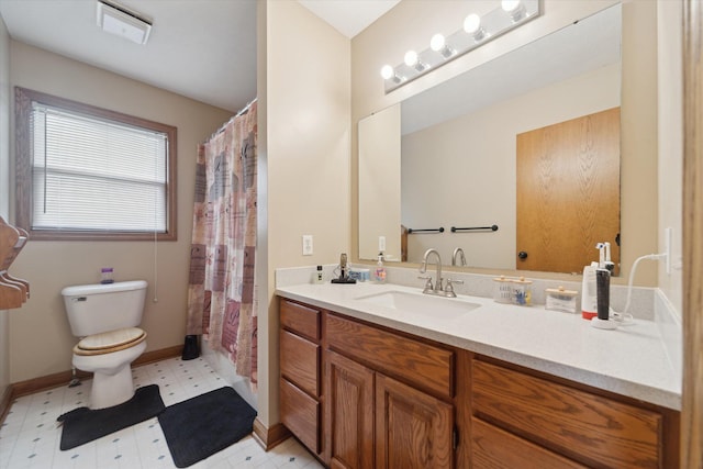bathroom with vanity, visible vents, toilet, tile patterned floors, and baseboards
