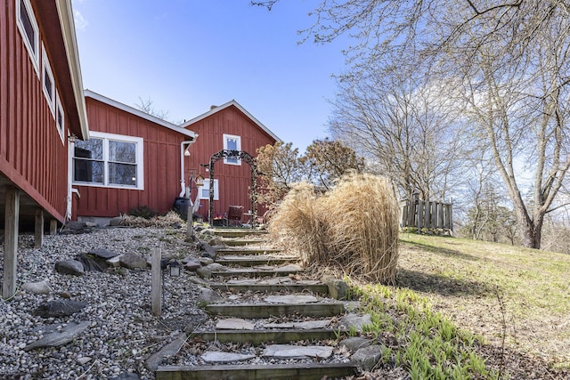 view of yard with a storage unit and an outbuilding