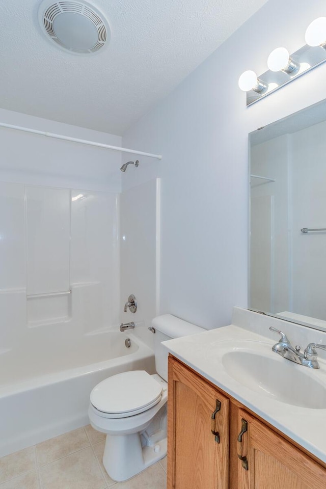 bathroom featuring vanity, tile patterned flooring, toilet, visible vents, and bathtub / shower combination