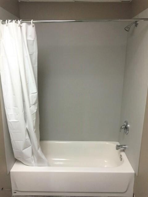 201 E Danaher St, Ludington, MI 49431 - bathroom featuring shower / bath combo