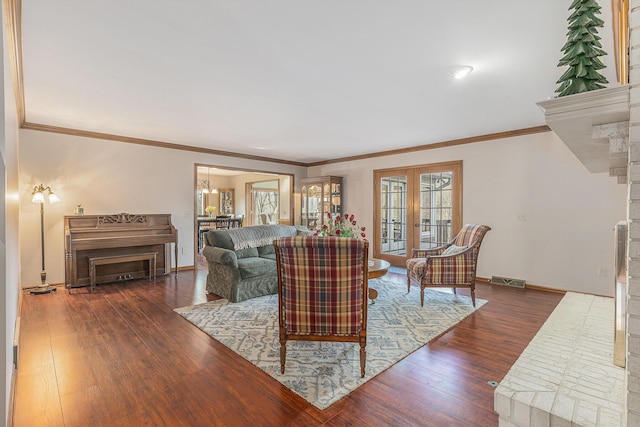 10159 E Rivershore Dr SE, Alto, MI 49302 - living room featuring crown molding, wood finished floors, baseboards, and visible vents