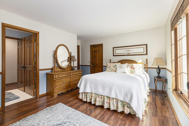 10159 E Rivershore Dr SE, Alto, MI 49302 - bedroom with baseboards and wood finished floors