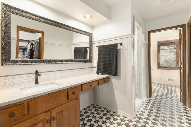 10159 E Rivershore Dr SE, Alto, MI 49302 - full bath featuring tile patterned floors, vanity, baseboards, and visible vents