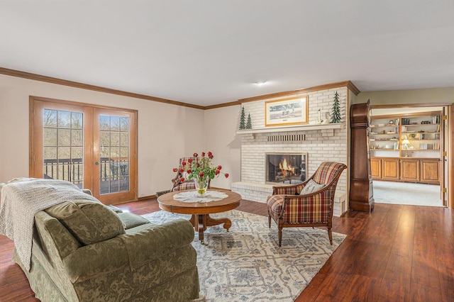 10159 E Rivershore Dr SE, Alto, MI 49302 - living room with baseboards, a brick fireplace, ornamental molding, wood finished floors, and french doors