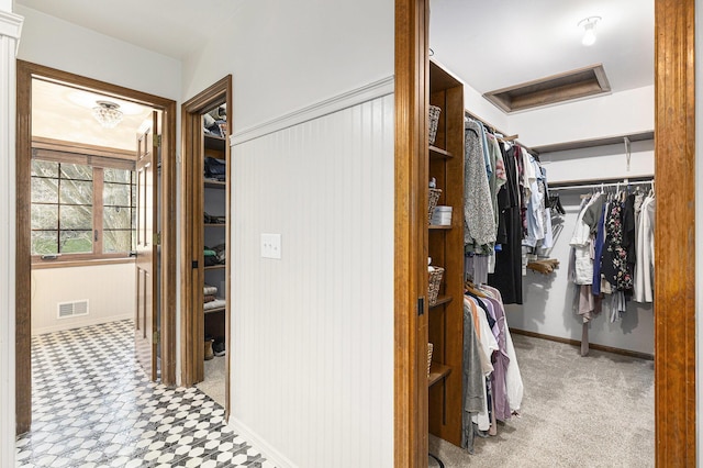 10159 E Rivershore Dr SE, Alto, MI 49302 - spacious closet featuring tile patterned floors, attic access, and visible vents