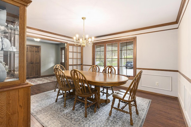 10159 E Rivershore Dr SE, Alto, MI 49302 - dining room with an inviting chandelier, a decorative wall, ornamental molding, wood finished floors, and a wainscoted wall
