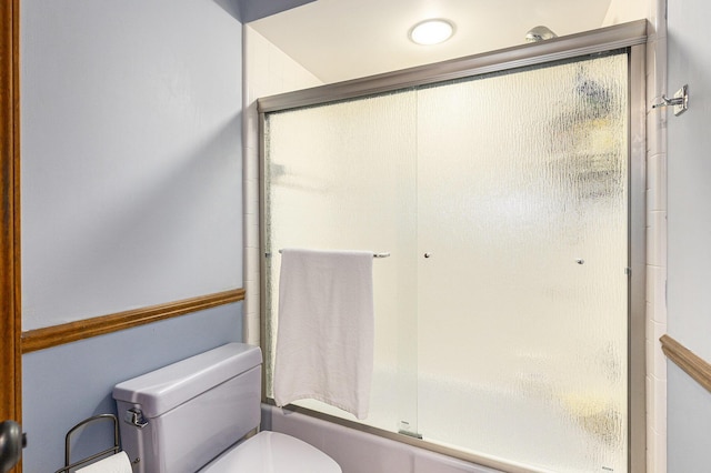 10159 E Rivershore Dr SE, Alto, MI 49302 - bathroom featuring toilet and shower / bath combination with glass door