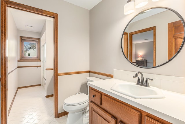 10159 E Rivershore Dr SE, Alto, MI 49302 - bathroom featuring toilet and vanity