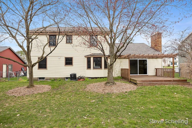 rear view of house featuring a yard, fence, cooling unit, and a wooden deck