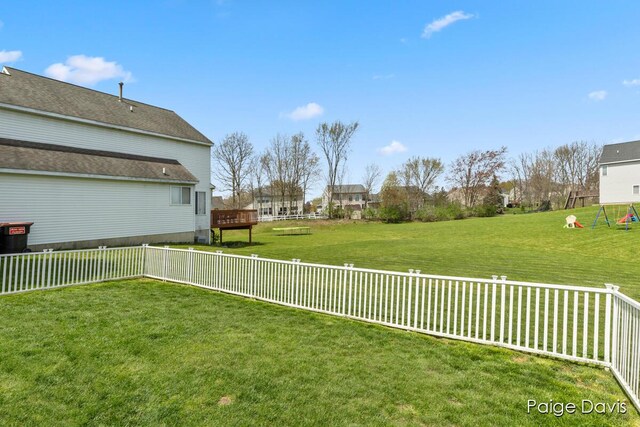 view of yard featuring fence private yard and a wooden deck