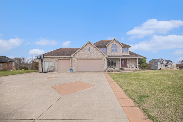 17 Coronado Dr, Jackson, MI 49201 - view of front of property featuring a front yard, a garage, driveway, and roof with shingles