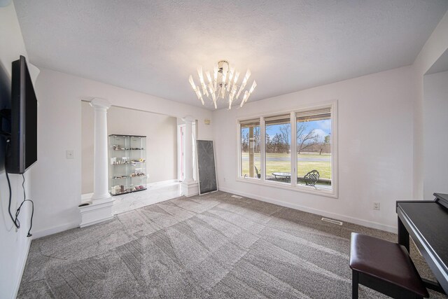 17 Coronado Dr, Jackson, MI 49201 - unfurnished living room with decorative columns, a notable chandelier, and baseboards