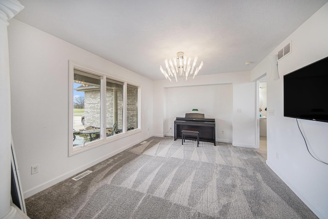 17 Coronado Dr, Jackson, MI 49201 - interior space with an inviting chandelier, light colored carpet, baseboards, and visible vents