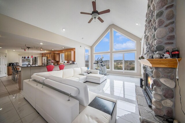 17 Coronado Dr, Jackson, MI 49201 - living room featuring recessed lighting, a fireplace, a ceiling fan, high vaulted ceiling, and marble finish floor