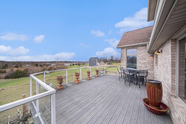 17 Coronado Dr, Jackson, MI 49201 - deck featuring outdoor dining space and a lawn
