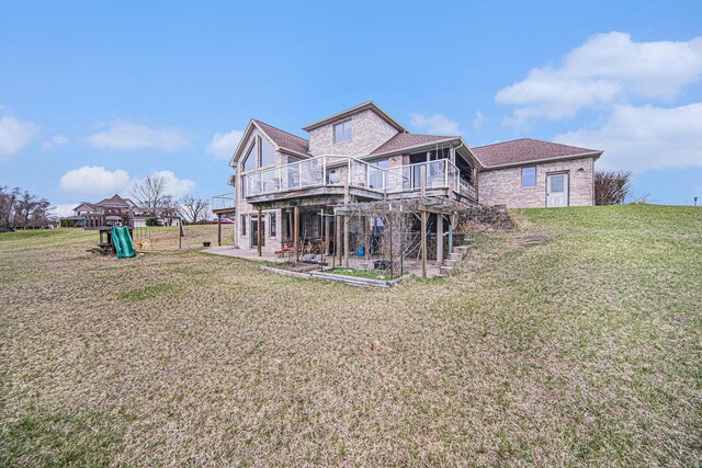 17 Coronado Dr, Jackson, MI 49201 - back of property featuring a patio area, stairway, a deck, and a lawn