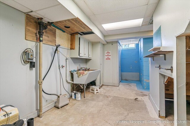 1220 W Green St, Hastings, MI 49058 - basement featuring a paneled ceiling and a sink