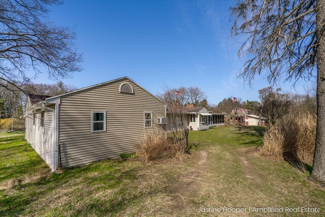 1220 W Green St, Hastings, MI 49058 - view of side of home featuring a lawn