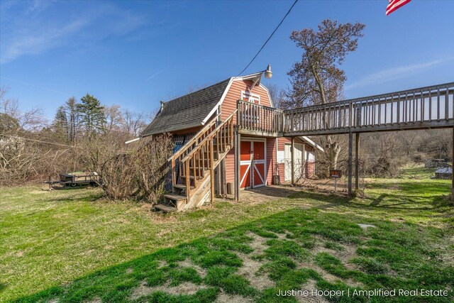 1220 W Green St, Hastings, MI 49058 - exterior space with a shingled roof, a barn, a lawn, an outbuilding, and a gambrel roof